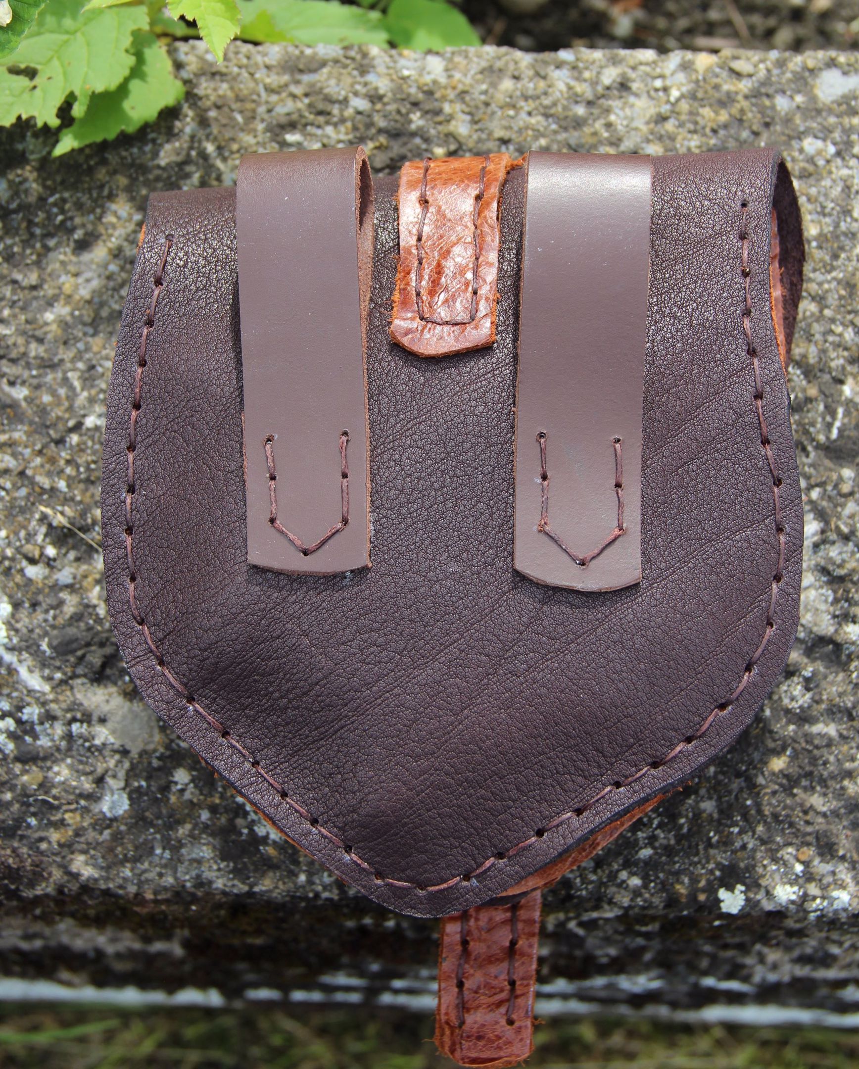 spitz zulaufend dunkelbraun